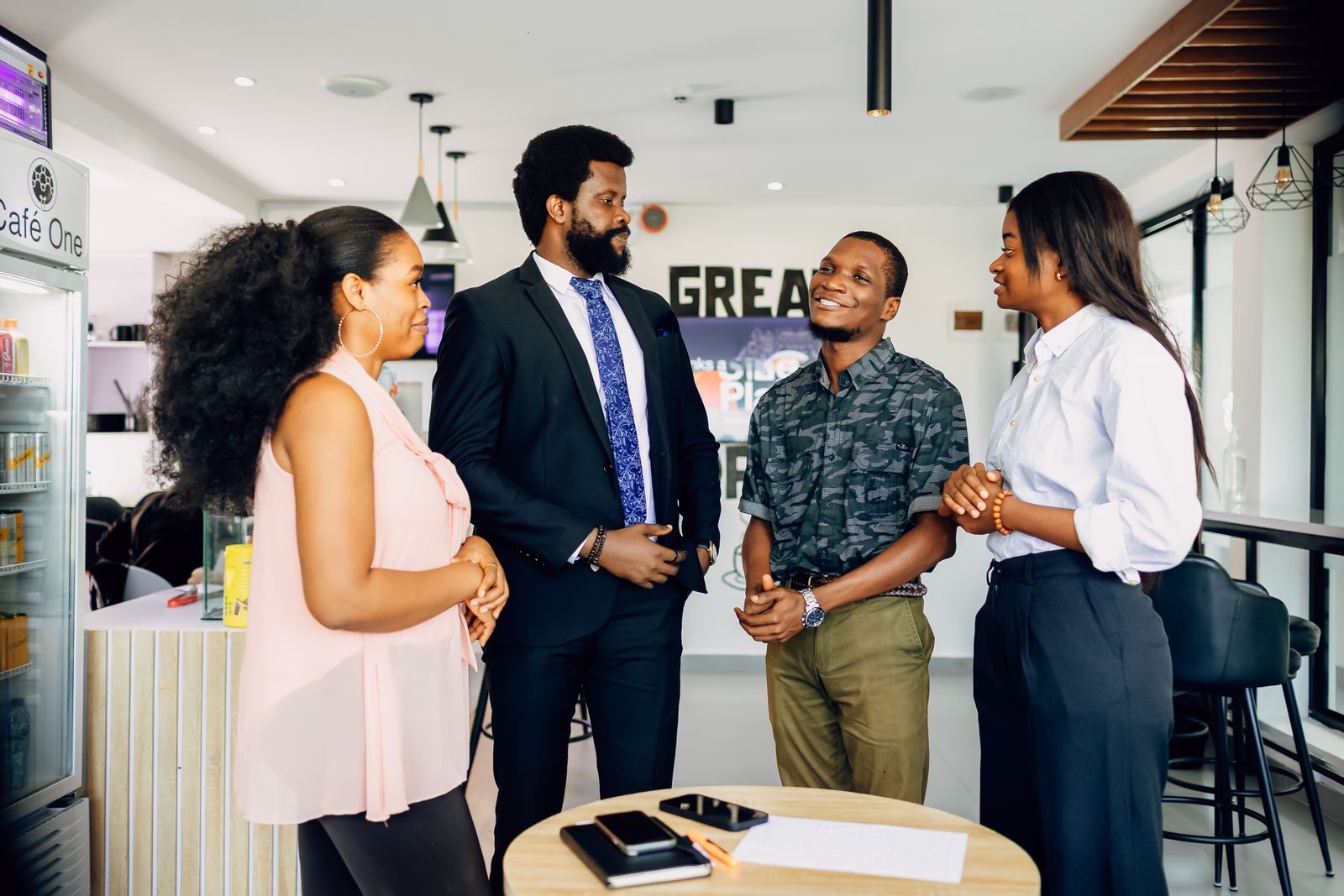A group of colleagues talking together in a modern office