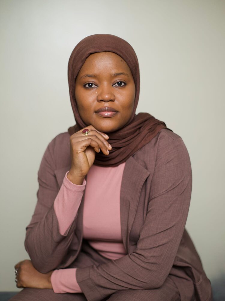 Portrait of a woman in a brown hijab and blazer
