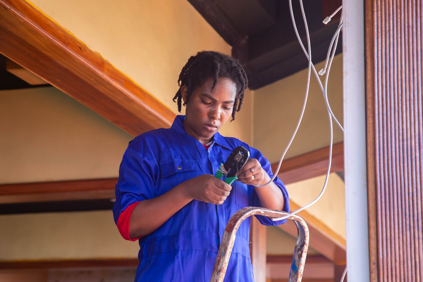 Electrician working on wiring indoors